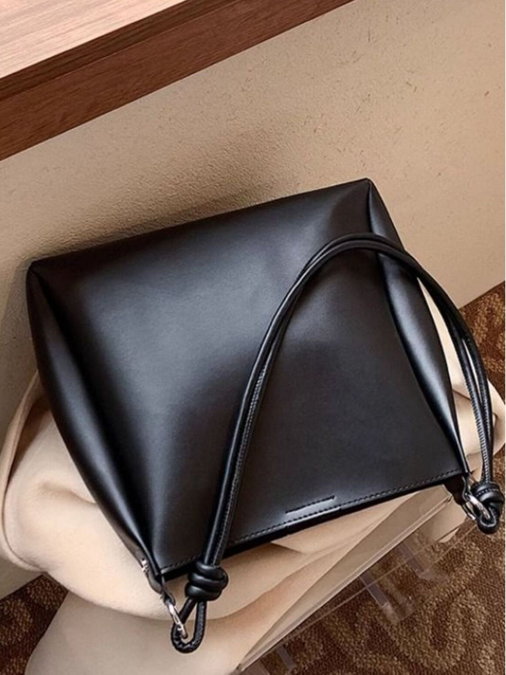 Structured PU leather shoulder bag laying down