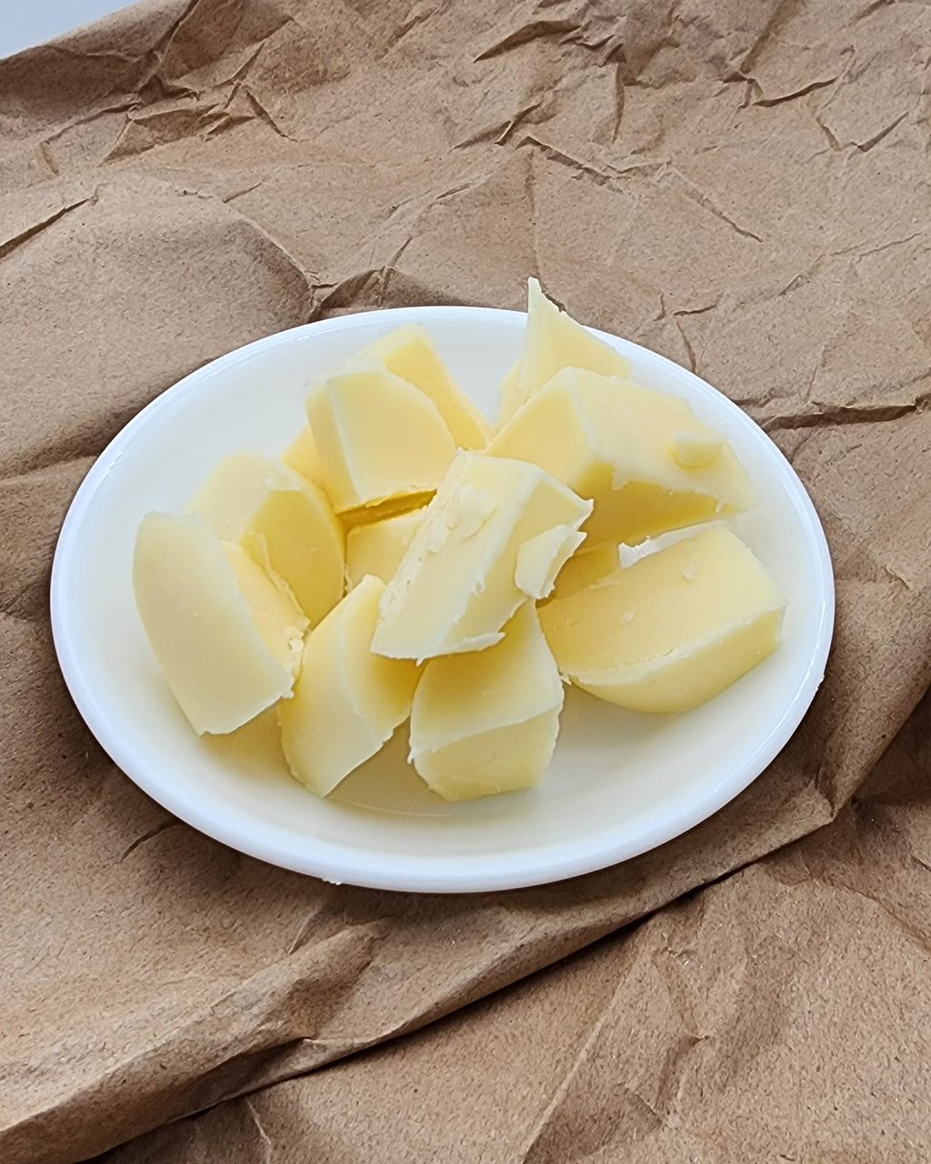 Lady G Soap Co. raw lotion bar chunks before custom molding.