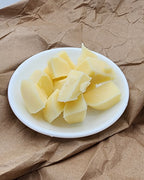 Lady G Soap Co. raw lotion bar chunks before custom molding.