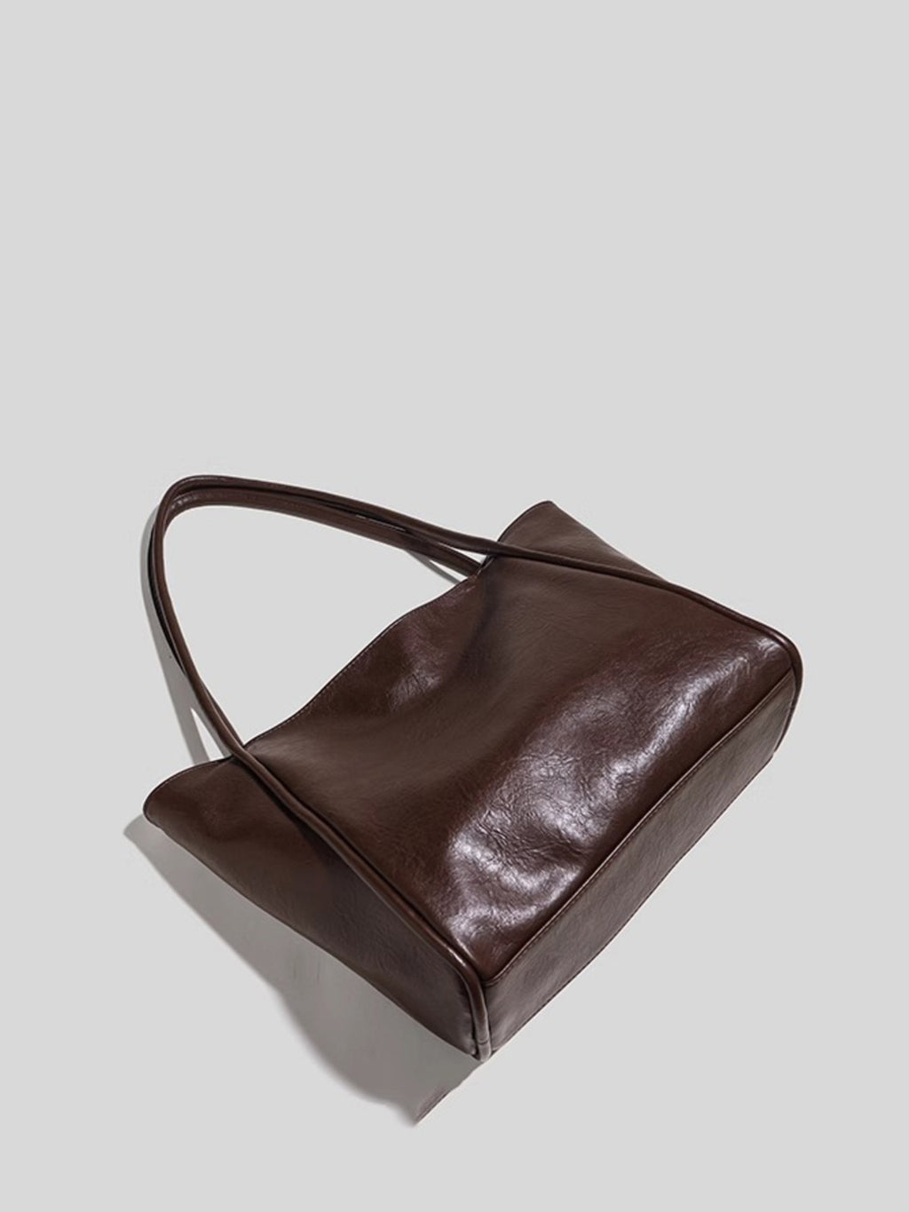 PU leather tote bag with double handles showing side and bottom