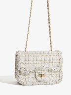Classic tweed shoulder bag showing chain strap