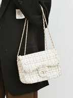 Classic tweed shoulder bag chain doubled slung over arm