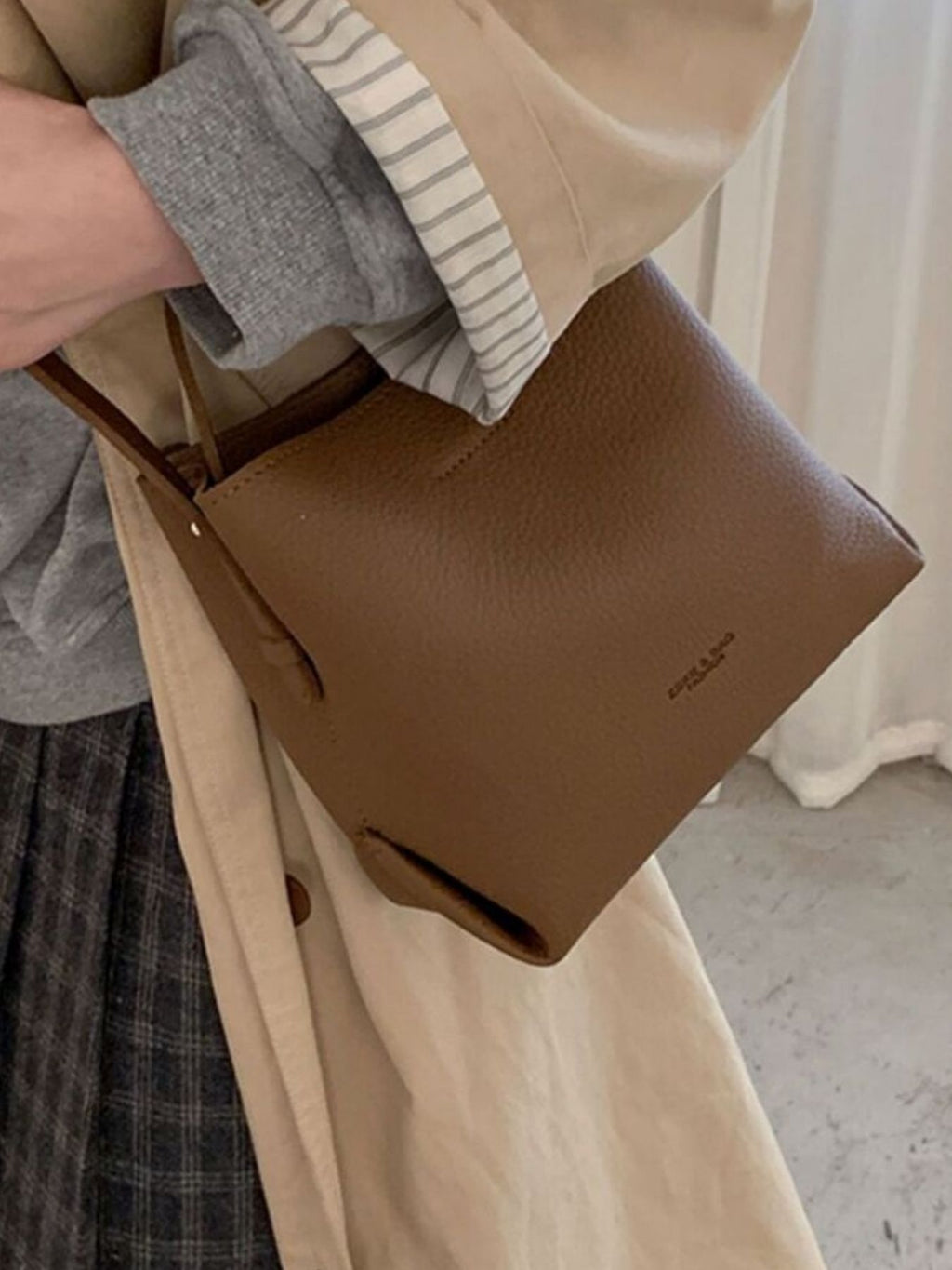 PU leather bucket crossbody bag closer up shows texture