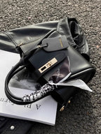 Structured mini satchel crossbody laying down