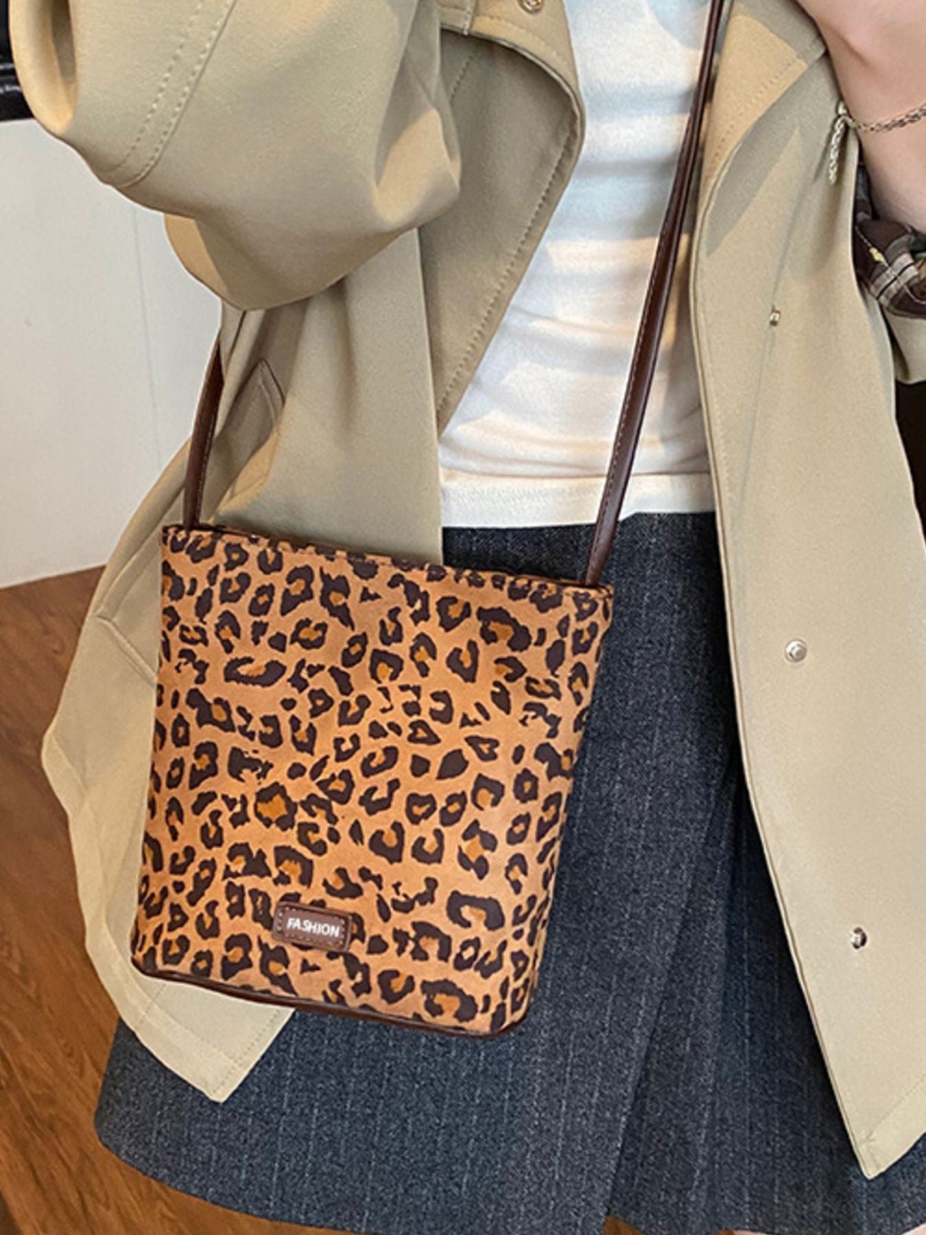 Leopard print crossbody bag worn crossbody