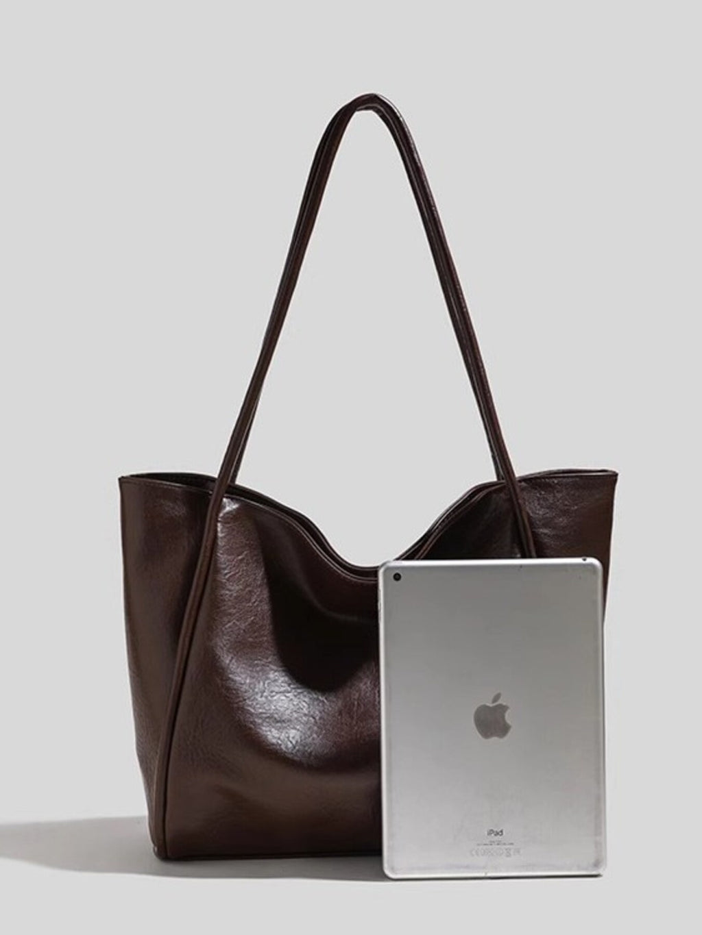 PU leather tote bag with double handles in size comparison with iPad