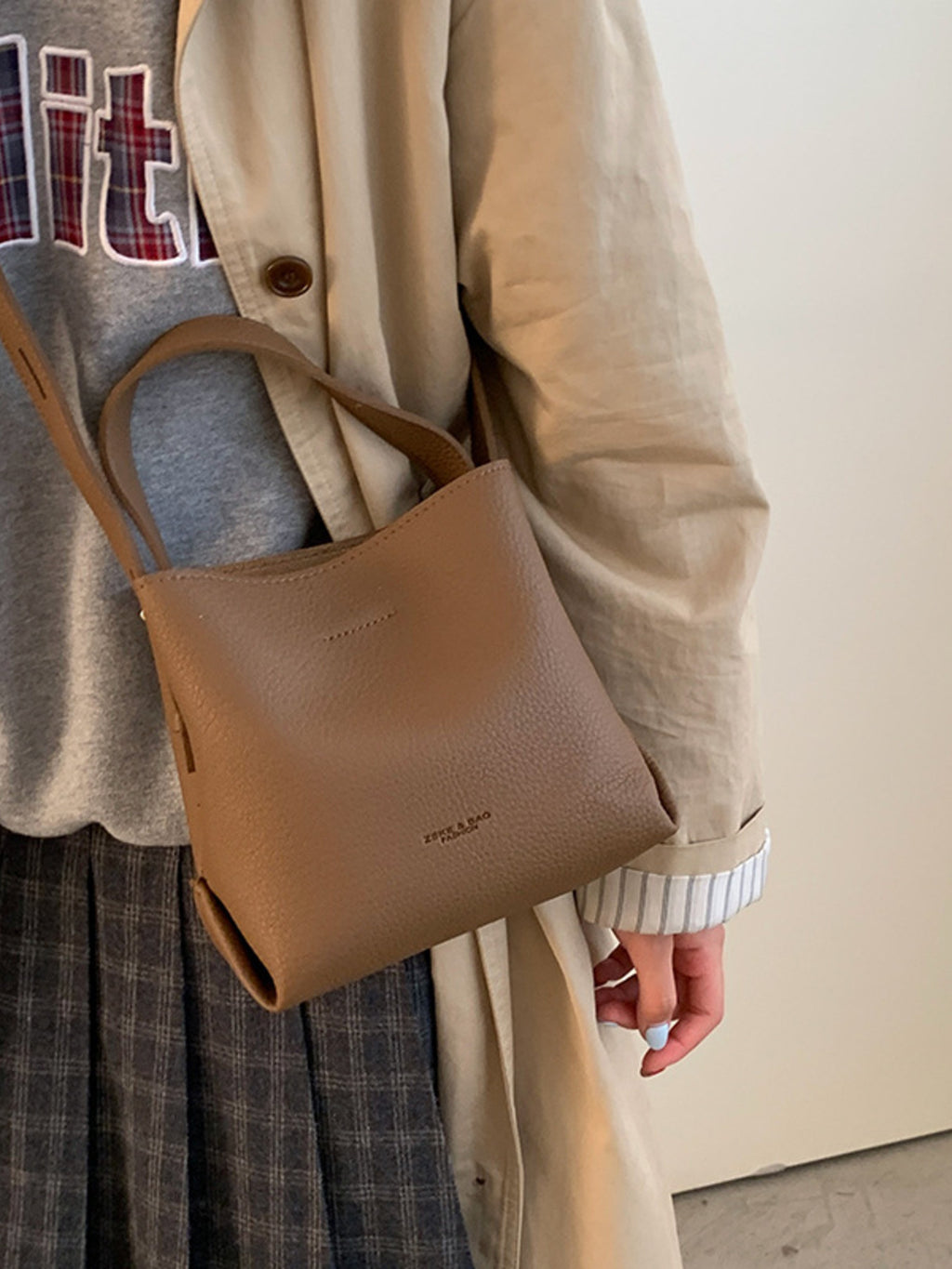 PU leather bucket crossbody bag worn crossbody