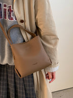 PU leather bucket crossbody bag worn crossbody