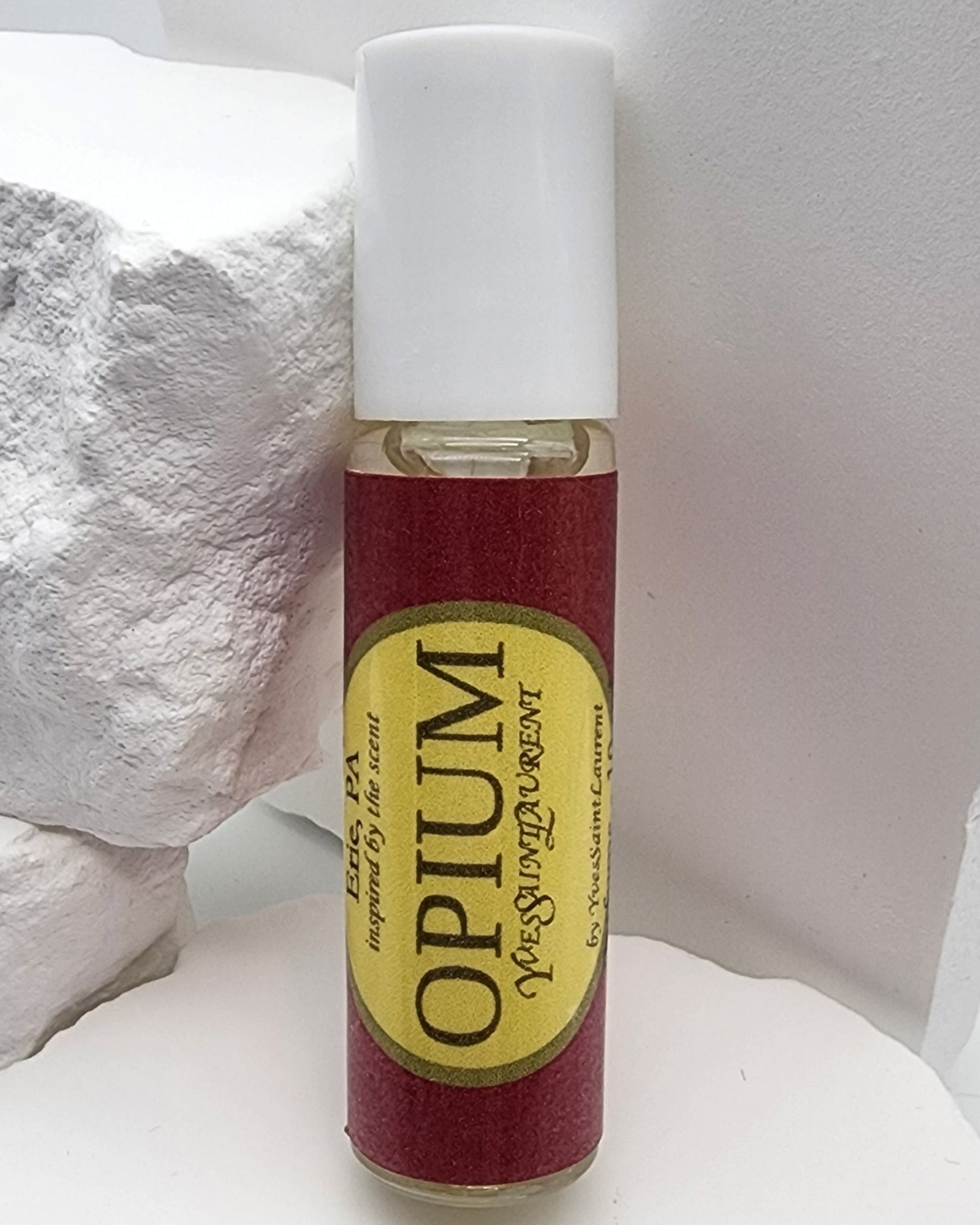 Perfume en roll-on Opium (mujer)